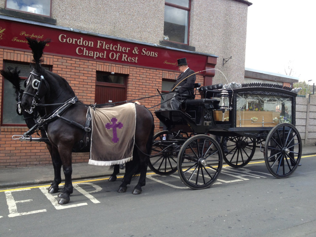 A horse and carriage in front of a funeral home in Spennymoor